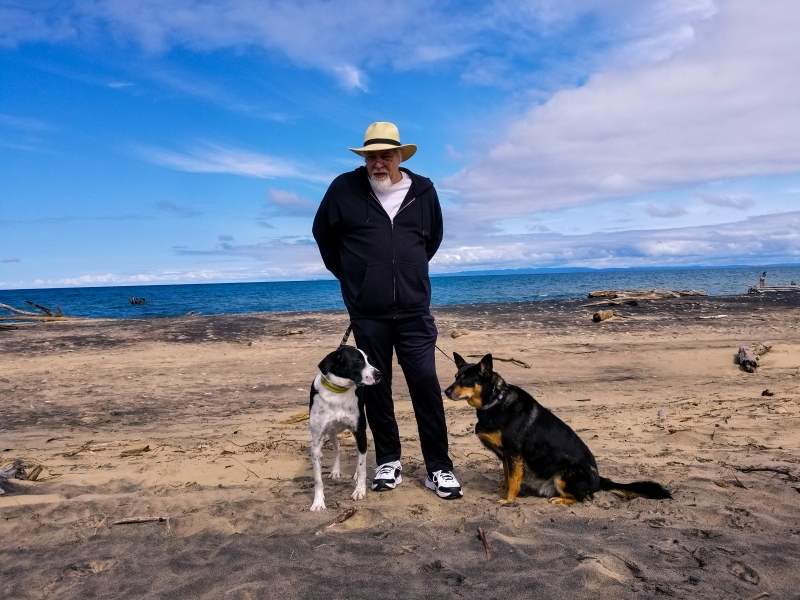 Dan and dogs on the shores of Lake Superior